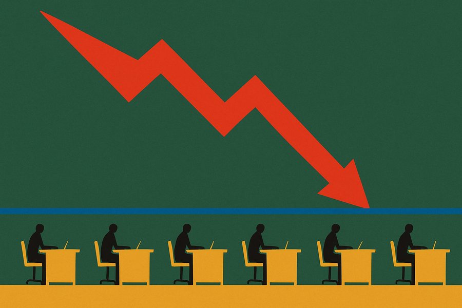 A huge red forecast arrow plunges down a wall above a long row of small office desks, but the desks are still occupied and a flat yellow line runs steadily along them, ignoring the alarm above.